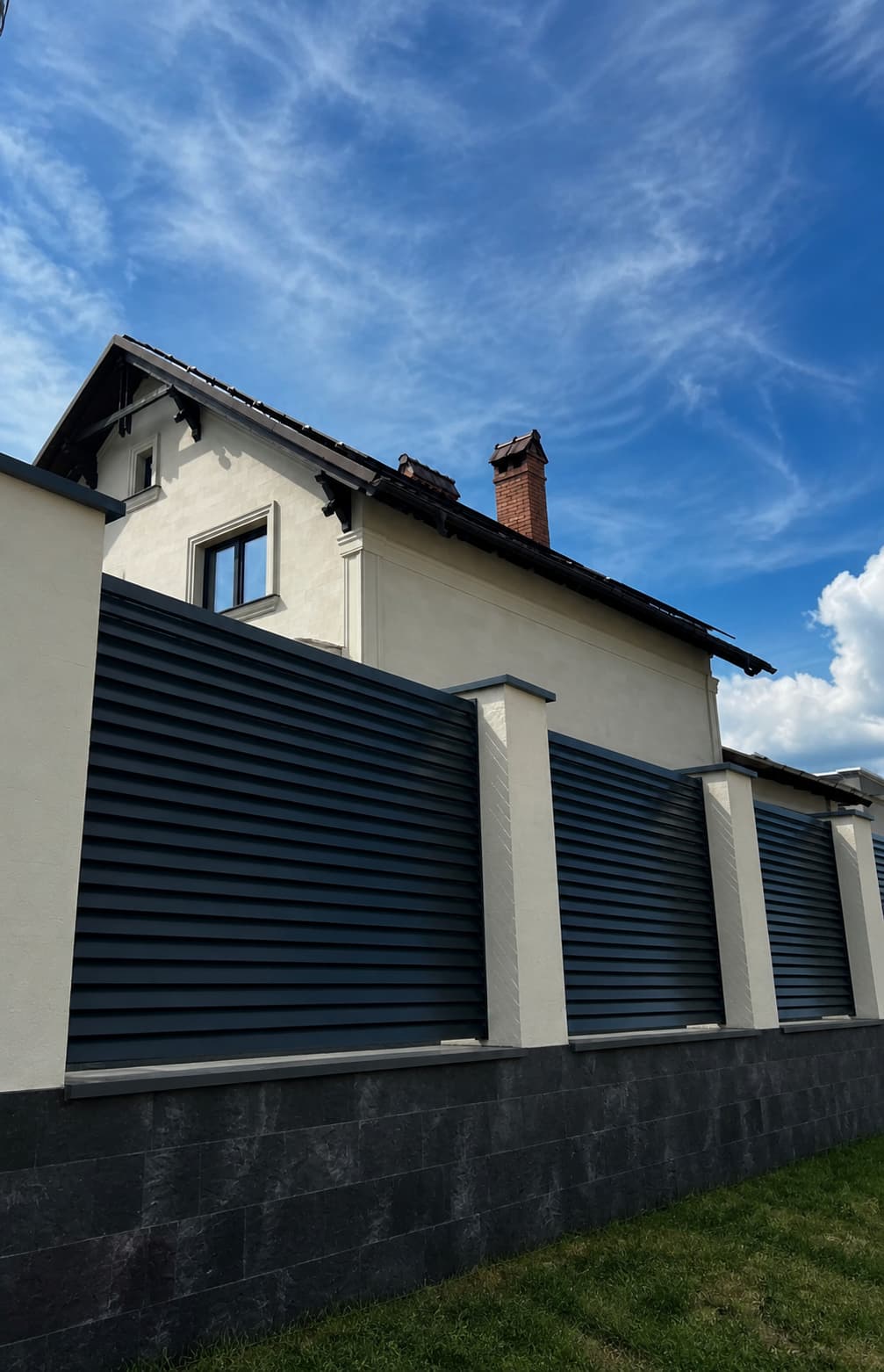 Ialoveni — the facade of a mansion clad in flexible tiles — 1